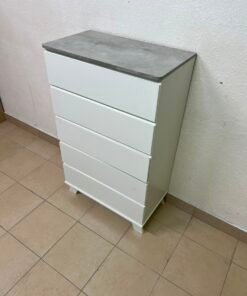 A modern white chest of drawers with a concrete-gray top, similar to models like the Colin from IKEA