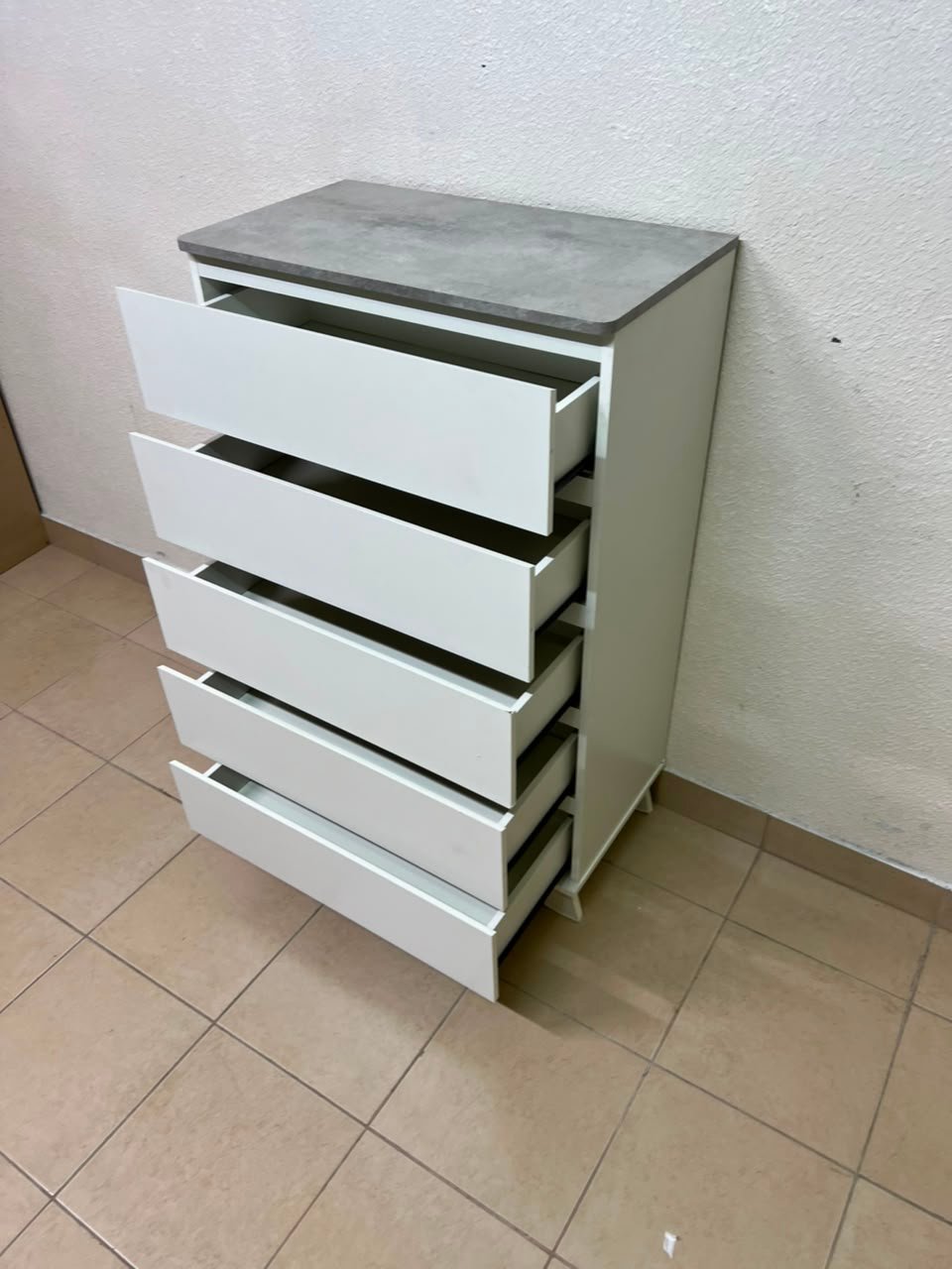 A modern white chest of drawers with a concrete-gray top, similar to models like the Colin from IKEA - Image 11