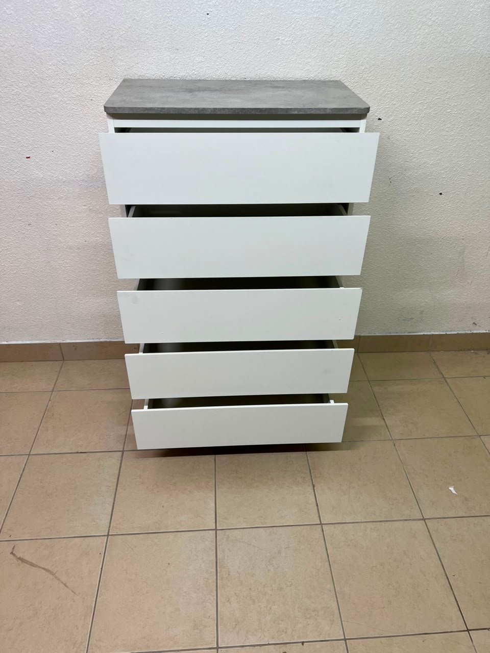 A modern white chest of drawers with a concrete-gray top, similar to models like the Colin from IKEA - Image 3