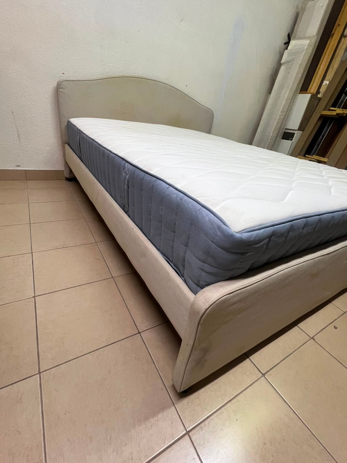 A bed from IKEA featuring a curved headboard and a beige upholstered base. - Image 2