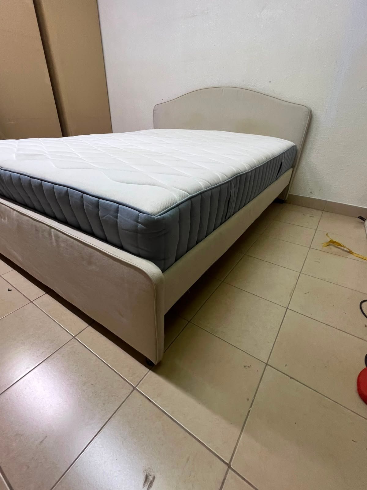 A bed from IKEA featuring a curved headboard and a beige upholstered base. - Image 10