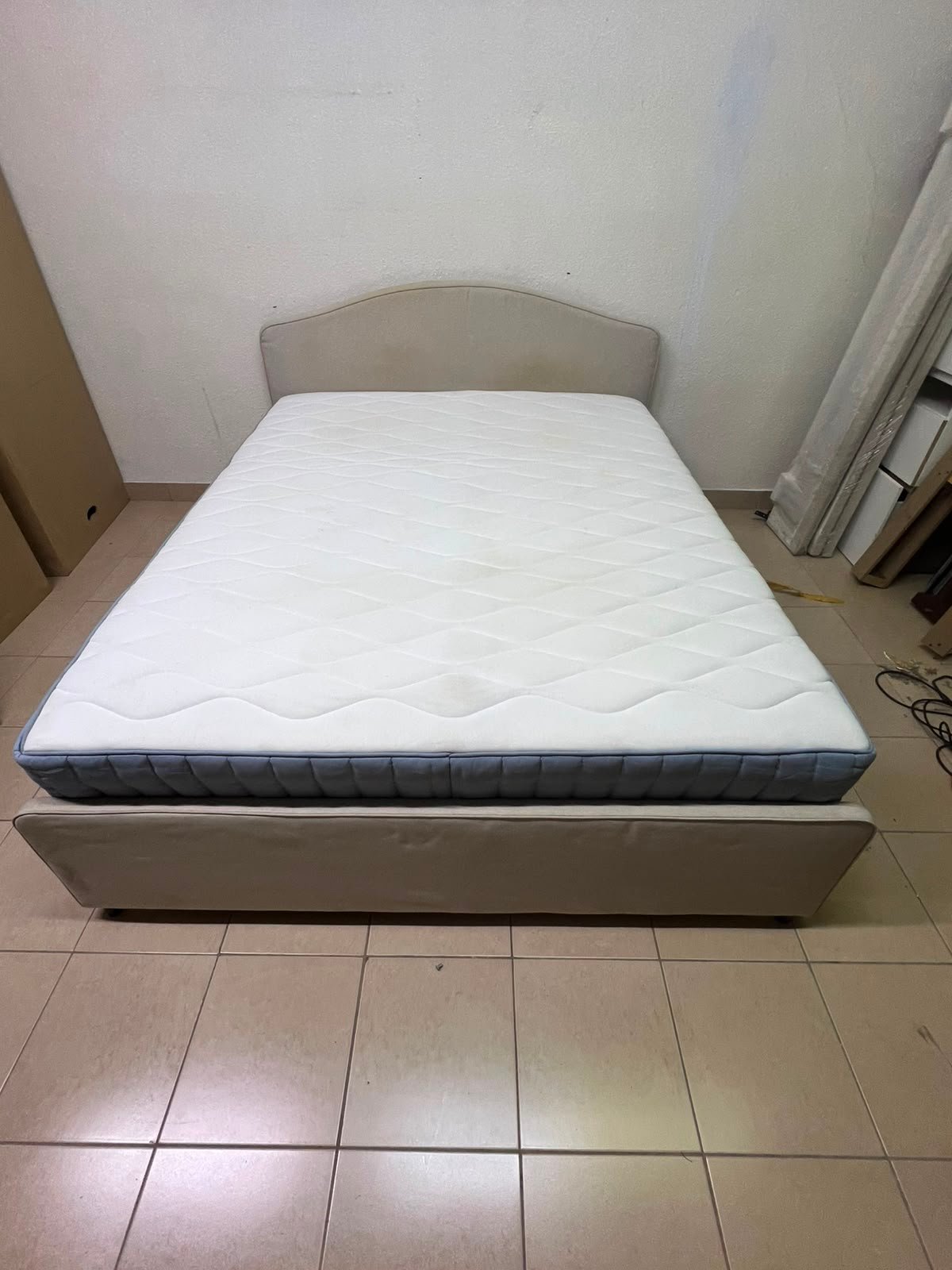 A bed from IKEA featuring a curved headboard and a beige upholstered base. - Image 6