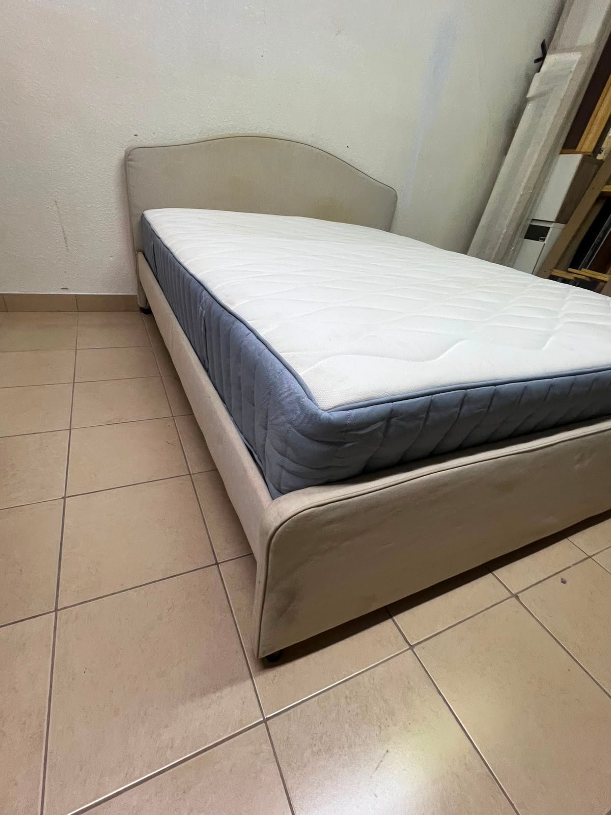 A bed from IKEA featuring a curved headboard and a beige upholstered base. - Image 5