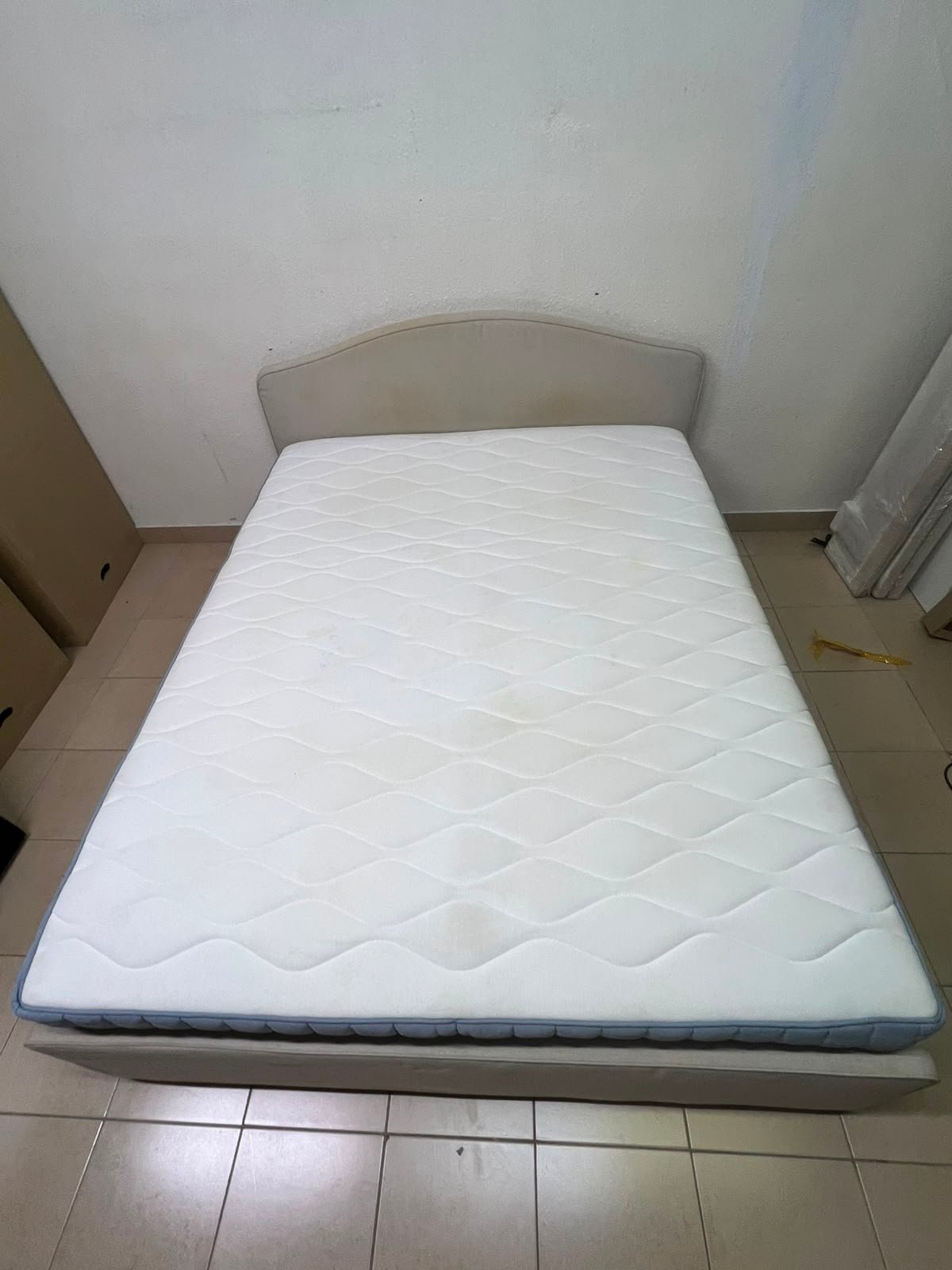 A bed from IKEA featuring a curved headboard and a beige upholstered base. - Image 13