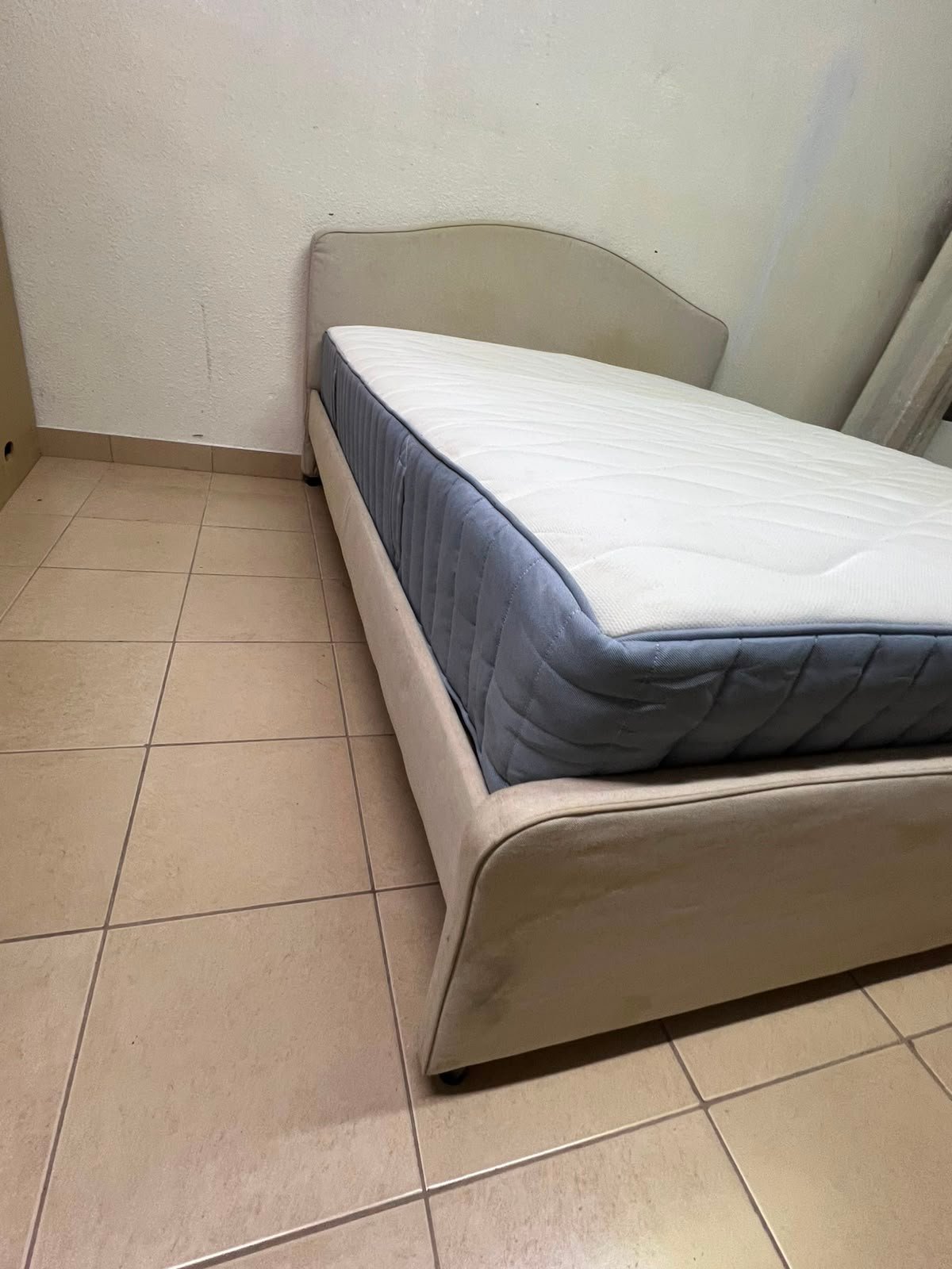 A bed from IKEA featuring a curved headboard and a beige upholstered base. - Image 4
