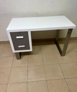 This modern white and gray desk from IKEA features a white top and sturdy metal legs.