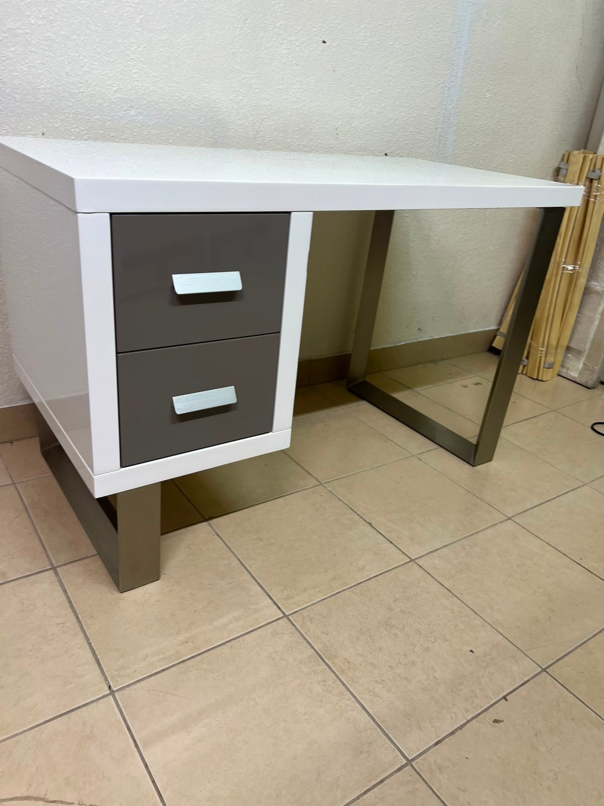 This modern white and gray desk from IKEA features a white top and sturdy metal legs. - Image 8