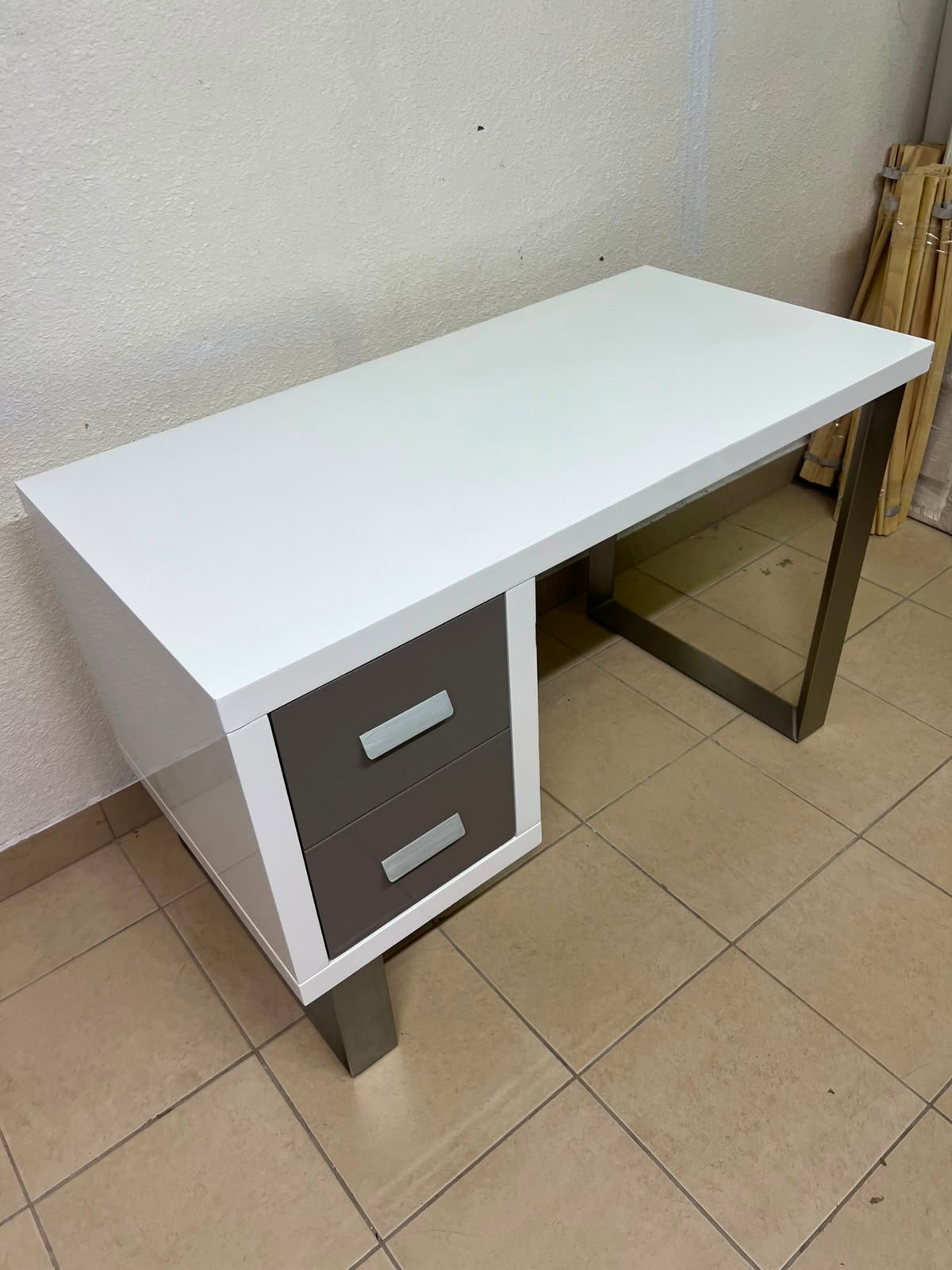 This modern white and gray desk from IKEA features a white top and sturdy metal legs. - Image 7