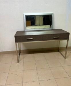 This Monarch Specialties console table features a modern design in gray with a metal frame.