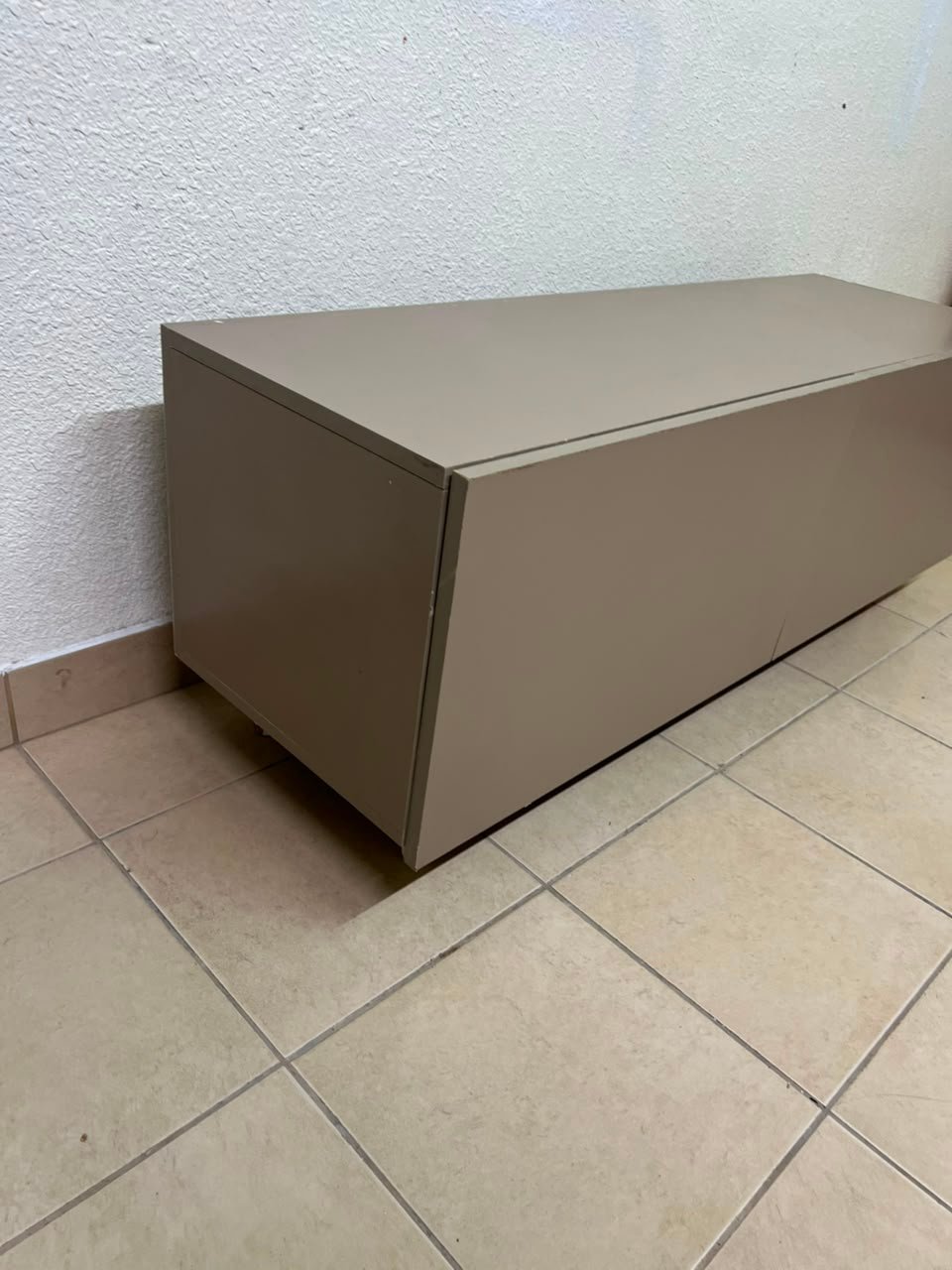The TV cabinet features a calm beige color and a simple, modern design. - Image 5