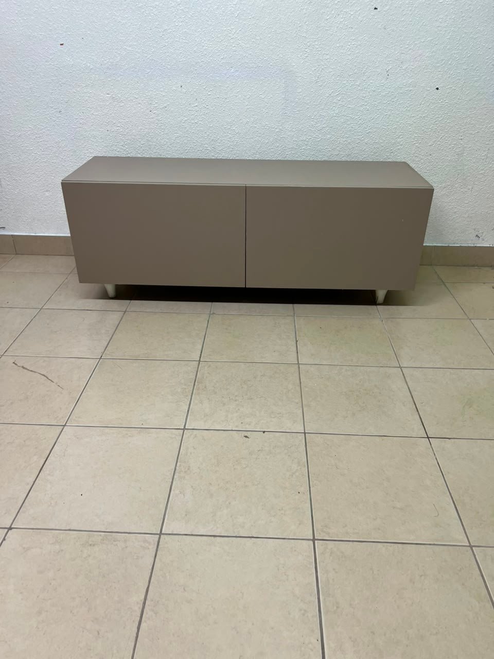 The TV cabinet features a calm beige color and a simple, modern design. - Image 4