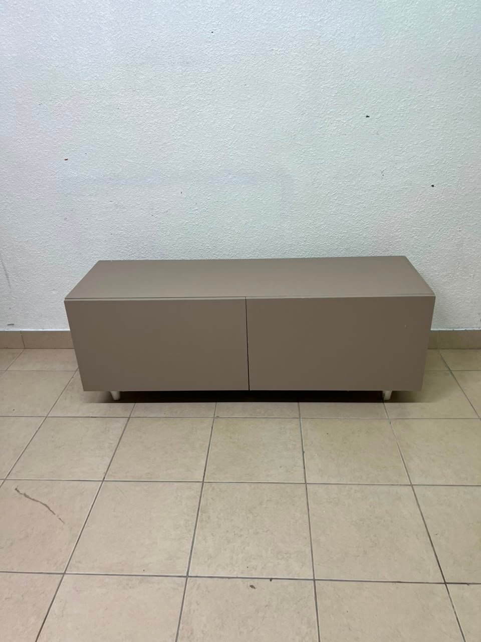 The TV cabinet features a calm beige color and a simple, modern design. - Image 2