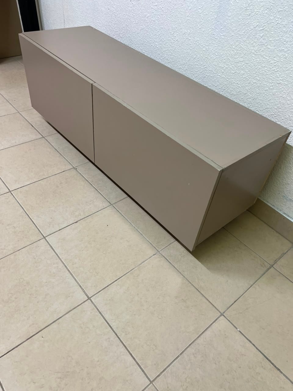The TV cabinet features a calm beige color and a simple, modern design. - Image 7