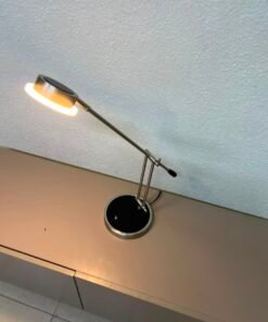 The Paulmann Zed LED desk lamp features a modern design and an adjustable arm.