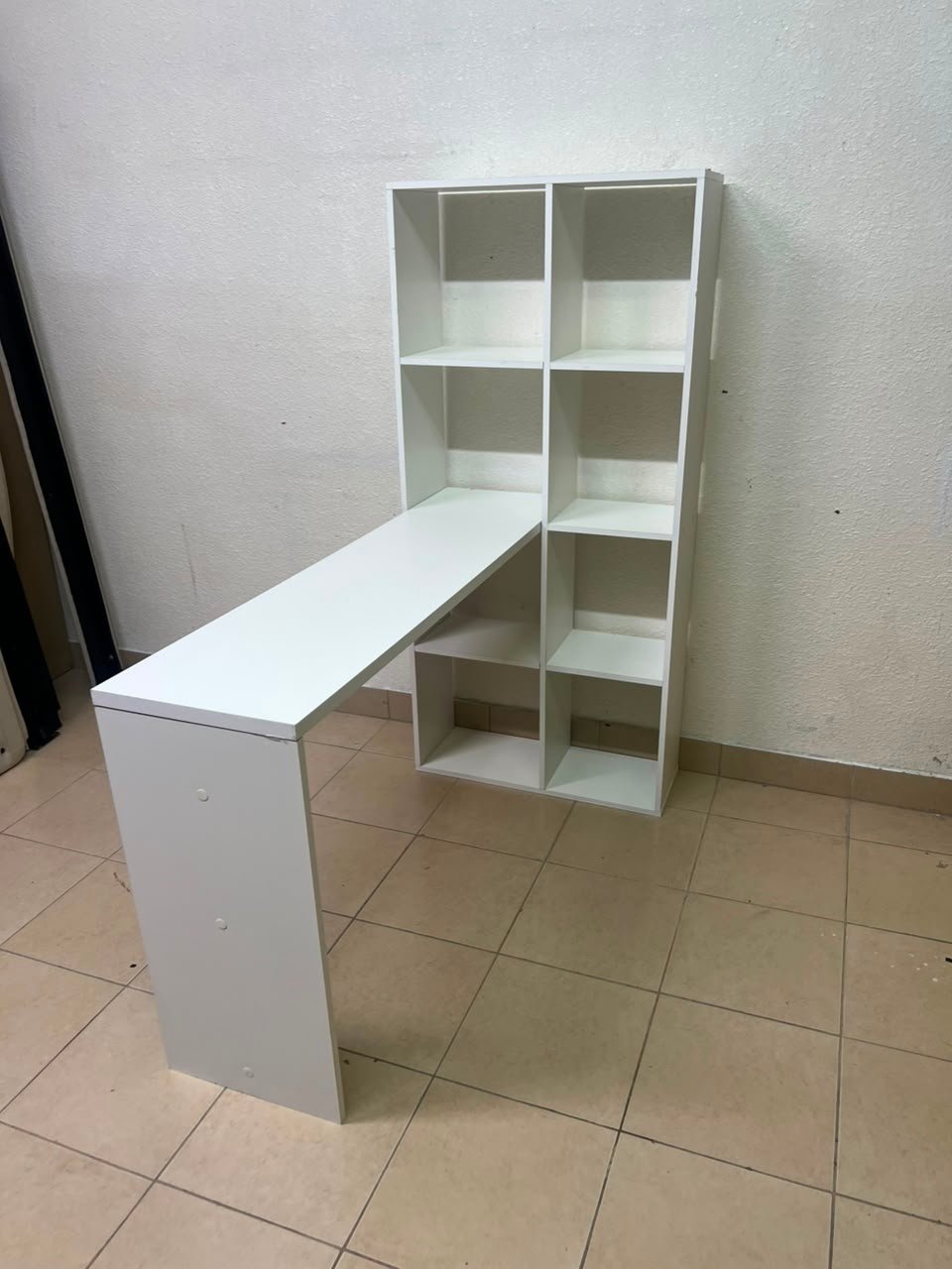 The "Amy Wood Home" desk, designed in London in white, features side shelves and ample storage space