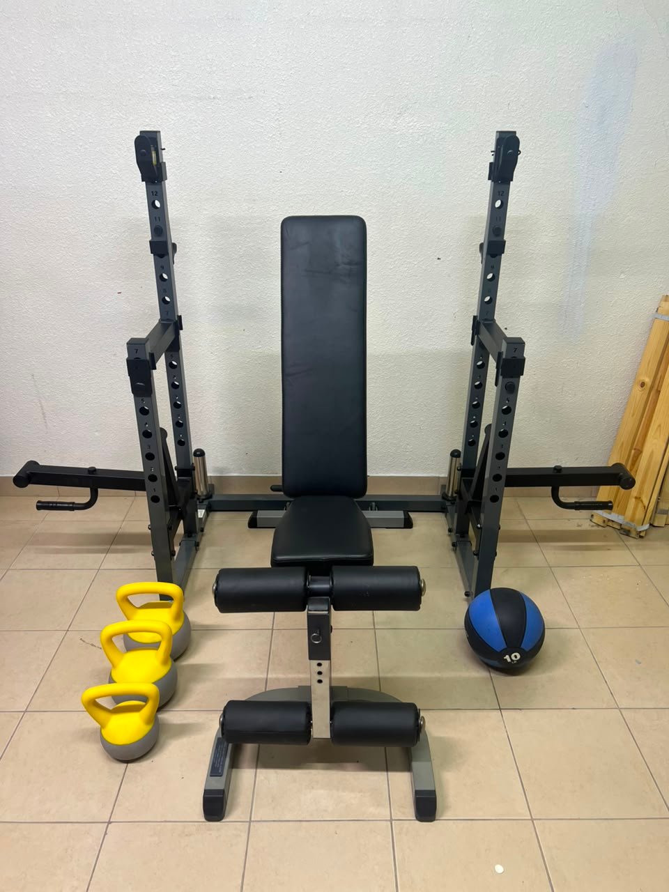 A complete home fitness equipment set including an adjustable push-up bench and weight rack.