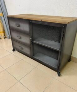 This is an industrial-style cabinet from Maisons du Monde, featuring a combination of wood and metal with wheels for easy movement.