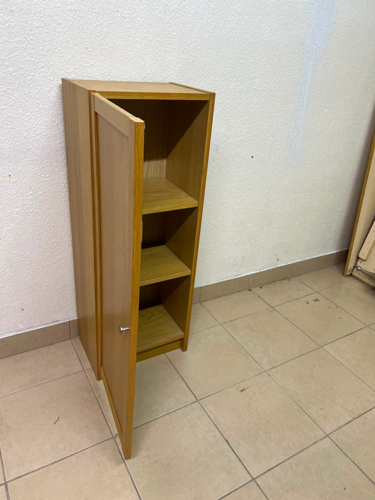 A narrow storage cabinet, either IKEA-style or similar, featuring a natural oak veneer finish. - Image 7