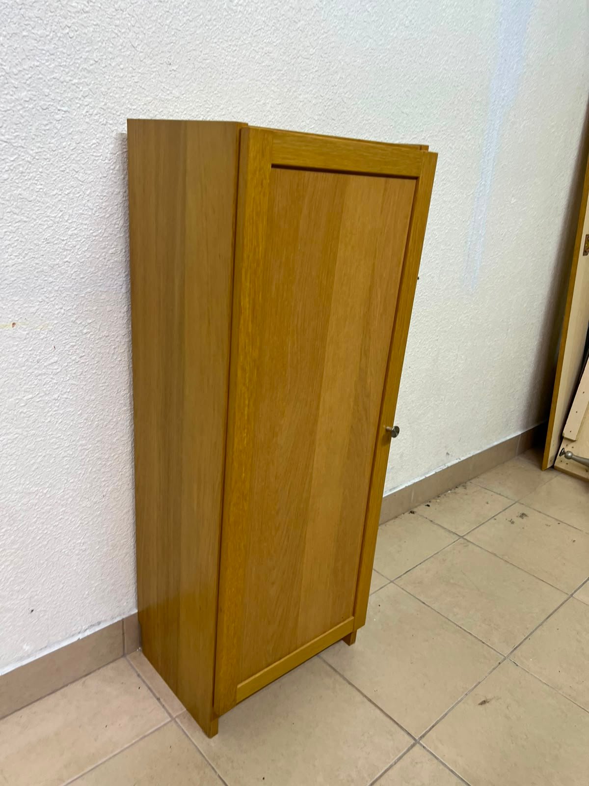 A narrow storage cabinet, either IKEA-style or similar, featuring a natural oak veneer finish. - Image 2