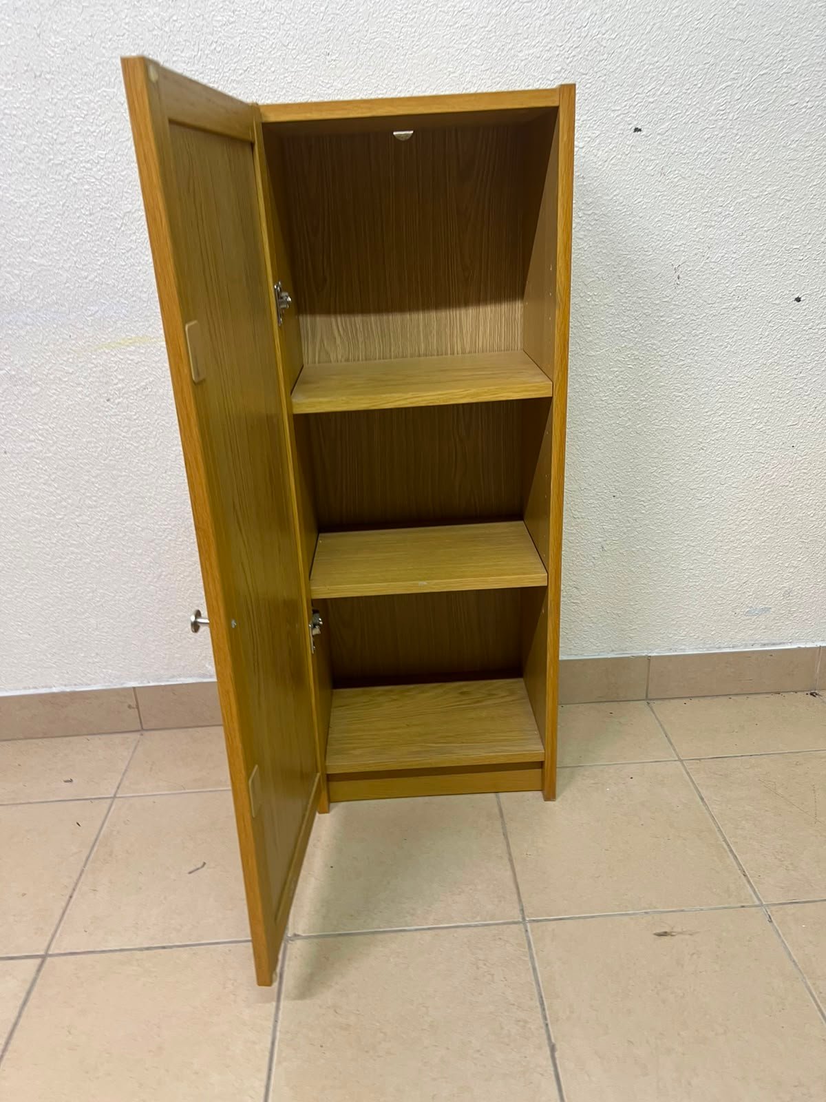 A narrow storage cabinet, either IKEA-style or similar, featuring a natural oak veneer finish. - Image 3