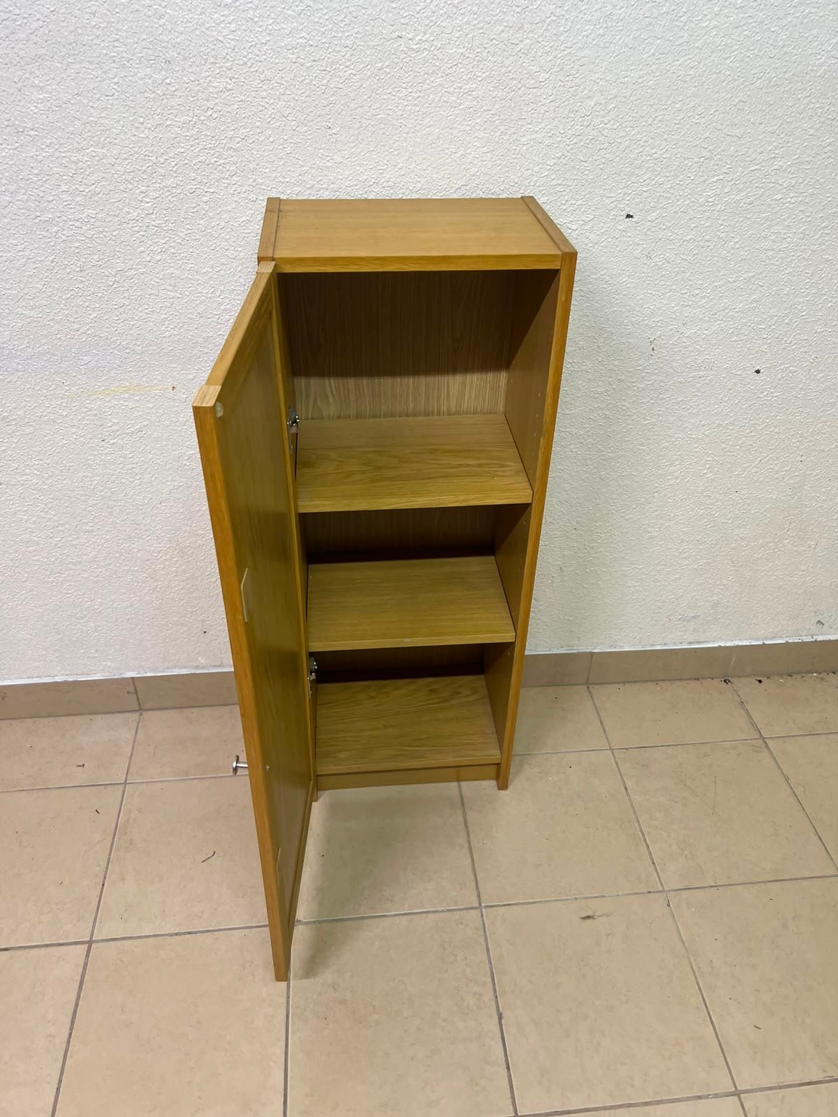A narrow storage cabinet, either IKEA-style or similar, featuring a natural oak veneer finish. - Image 10