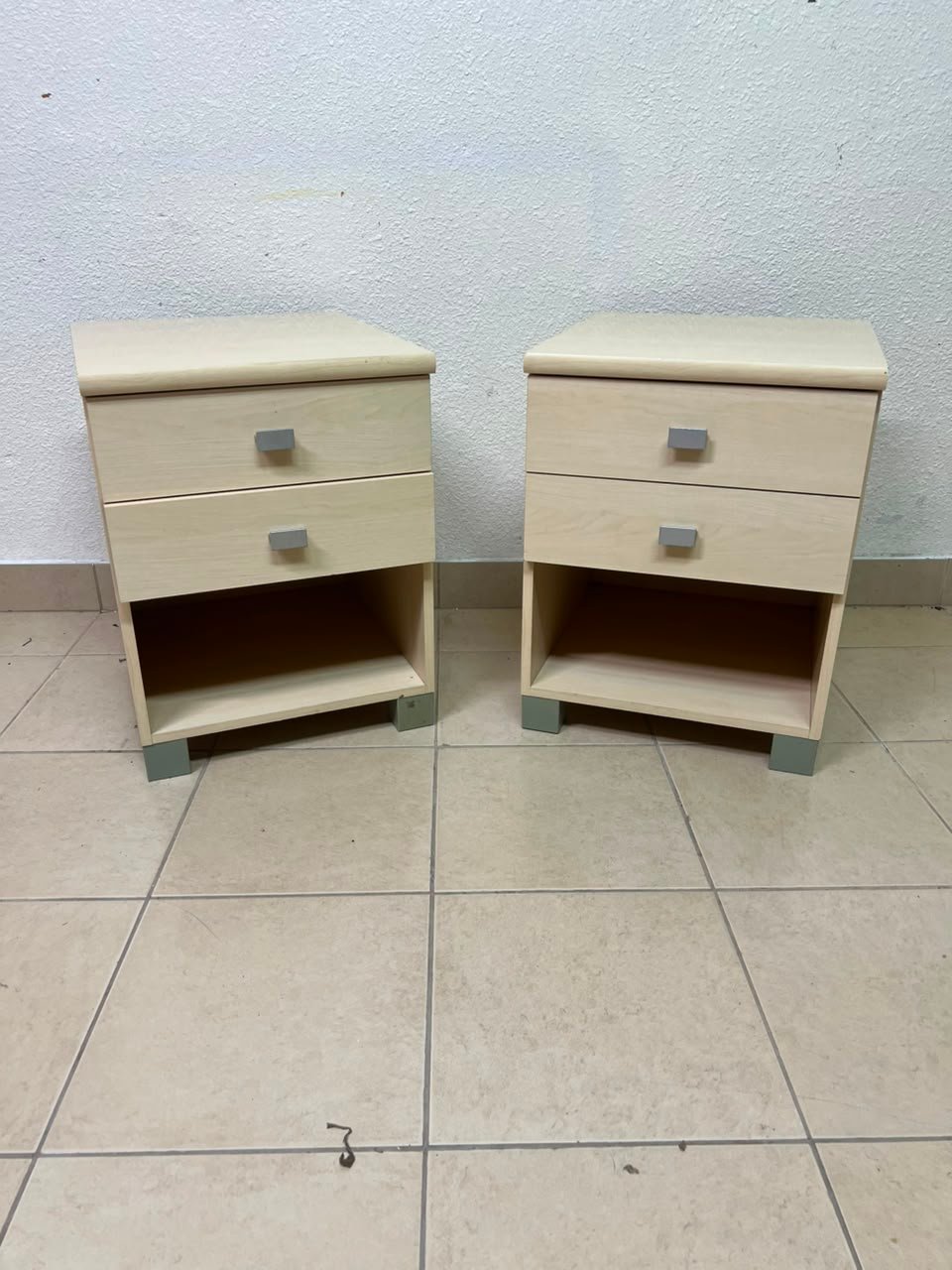 A set of two modern bedside tables in a light wood color with two drawers and open storage space. - Image 13