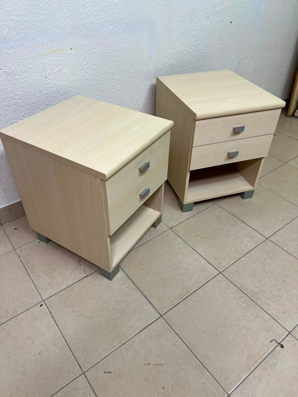 A set of two modern bedside tables in a light wood color with two drawers and open storage space. - Image 7