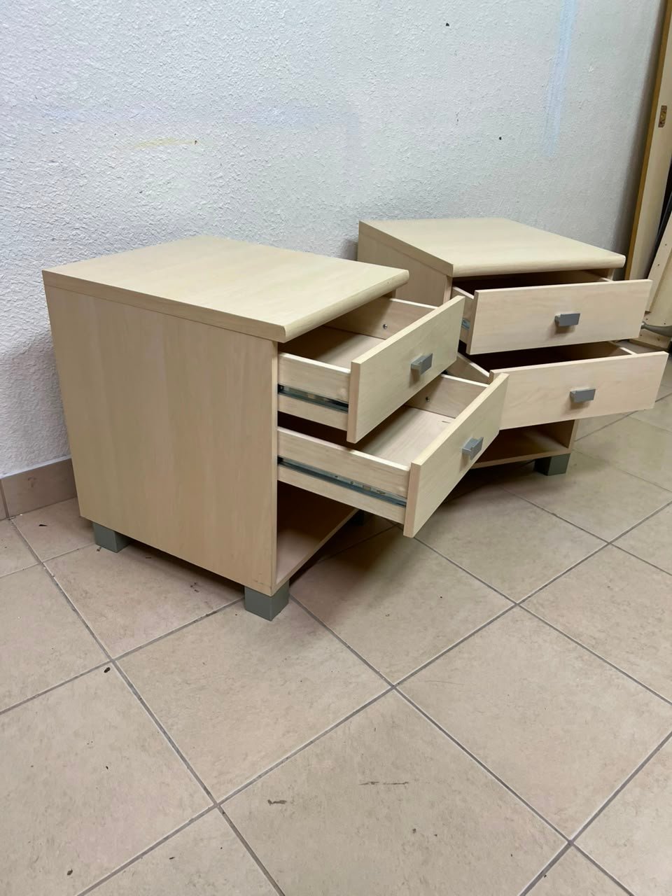 A set of two modern bedside tables in a light wood color with two drawers and open storage space. - Image 3