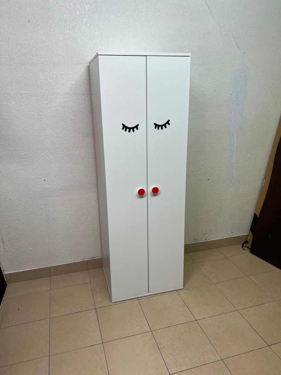 Whimsical Kids' Wardrobe with Sleeping Eyes Design – White 2-Door Storage Cabinet with Red Handles - Image 7