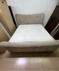 A classic diamond-patterned quilted bed with a mattress featuring soft velvet fabric in beige or gray. - Image 2