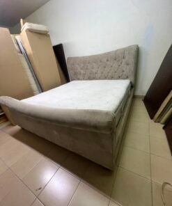 A classic diamond-patterned quilted bed with a mattress featuring soft velvet fabric in beige or gray. - Image 4