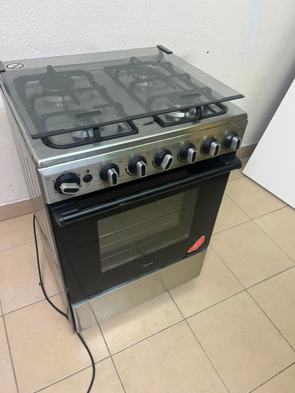 Midea Freestanding 4-Burner Gas Cooker with Oven – Stainless Steel Stove with Foldable Glass Lid & Storage Drawer - Image 3