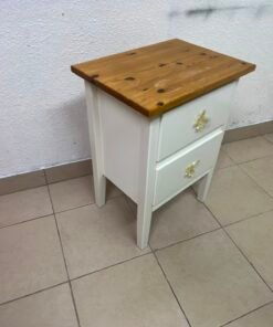 White bedside table with two drawers, butterfly-shaped crystal handles, and a natural wood top.