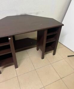 IKEA BRUSALI corner desk in brown featuring built-in storage shelves on the sides.