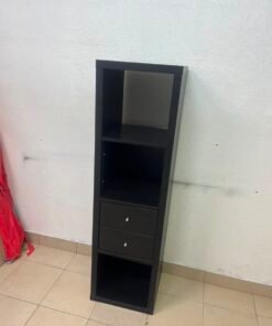 The IKEA KALLAX shelving unit, in black and brown, features a vertical design with built-in drawer units. - Image 2