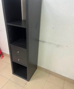 The IKEA KALLAX shelving unit, in black and brown, features a vertical design with built-in drawer units. - Image 3