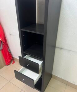 The IKEA KALLAX shelving unit, in black and brown, features a vertical design with built-in drawer units. - Image 6