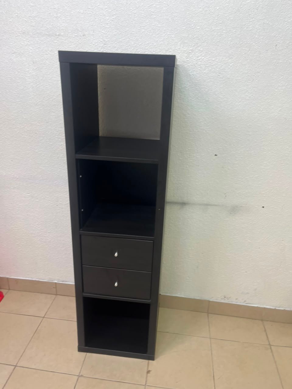 The IKEA KALLAX shelving unit, in black and brown, features a vertical design with built-in drawer units. - Image 7