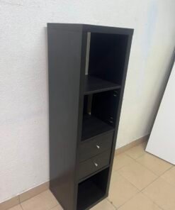The IKEA KALLAX shelving unit, in black and brown, features a vertical design with built-in drawer units. - Image 8