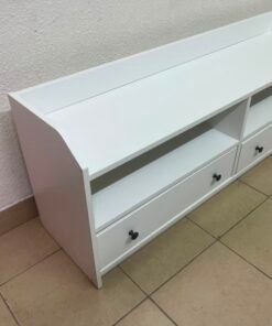 The IKEA HAUGA TV stand in white features a classic design with two drawers and open spaces. - Image 2