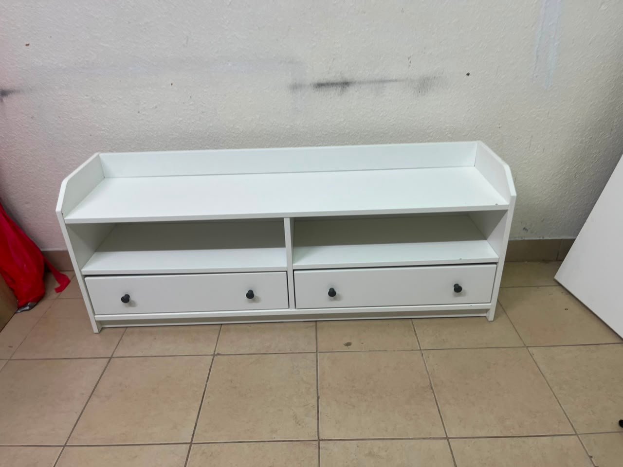 The IKEA HAUGA TV stand in white features a classic design with two drawers and open spaces. - Image 3
