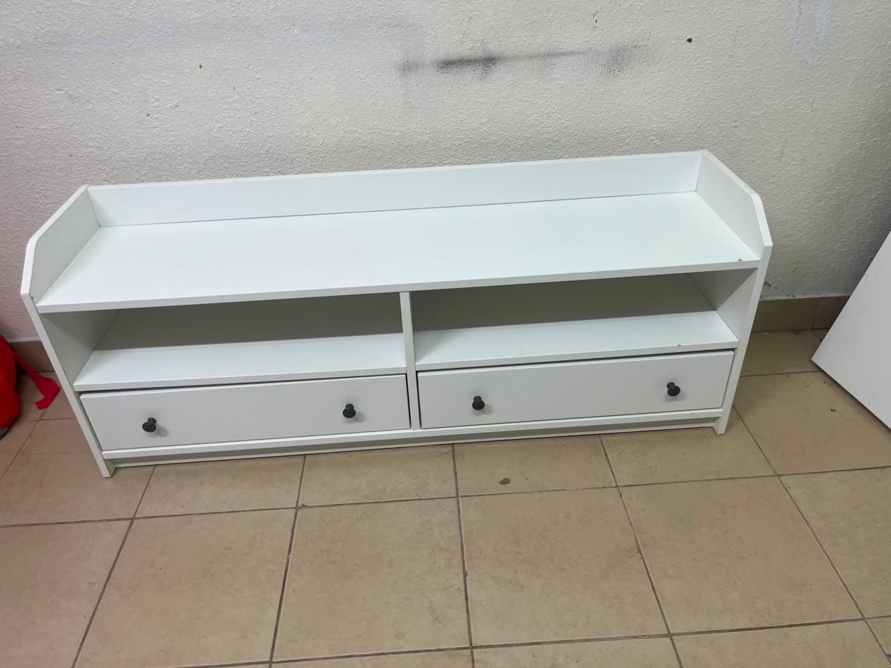 The IKEA HAUGA TV stand in white features a classic design with two drawers and open spaces. - Image 4