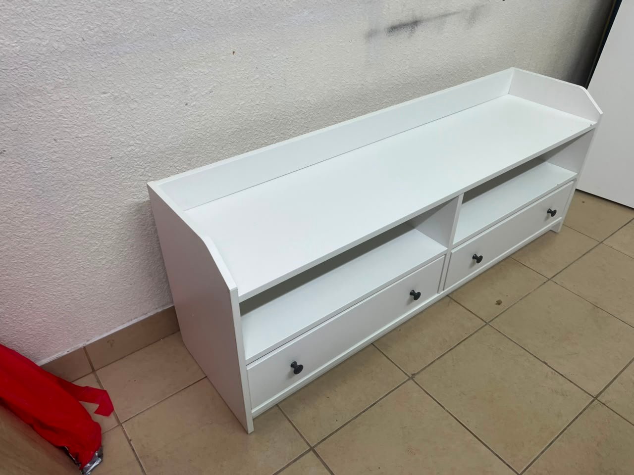 The IKEA HAUGA TV stand in white features a classic design with two drawers and open spaces. - Image 5