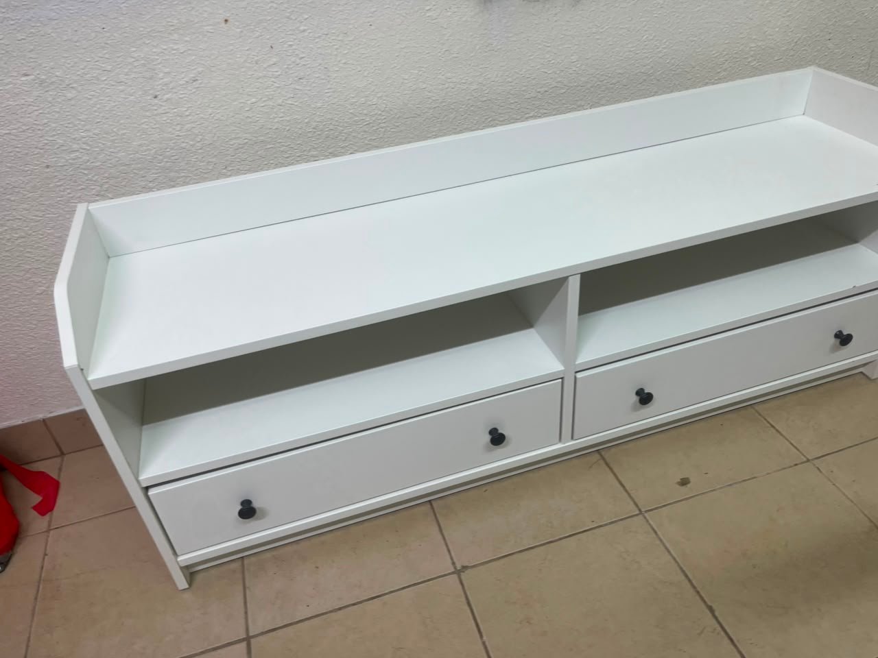 The IKEA HAUGA TV stand in white features a classic design with two drawers and open spaces. - Image 6