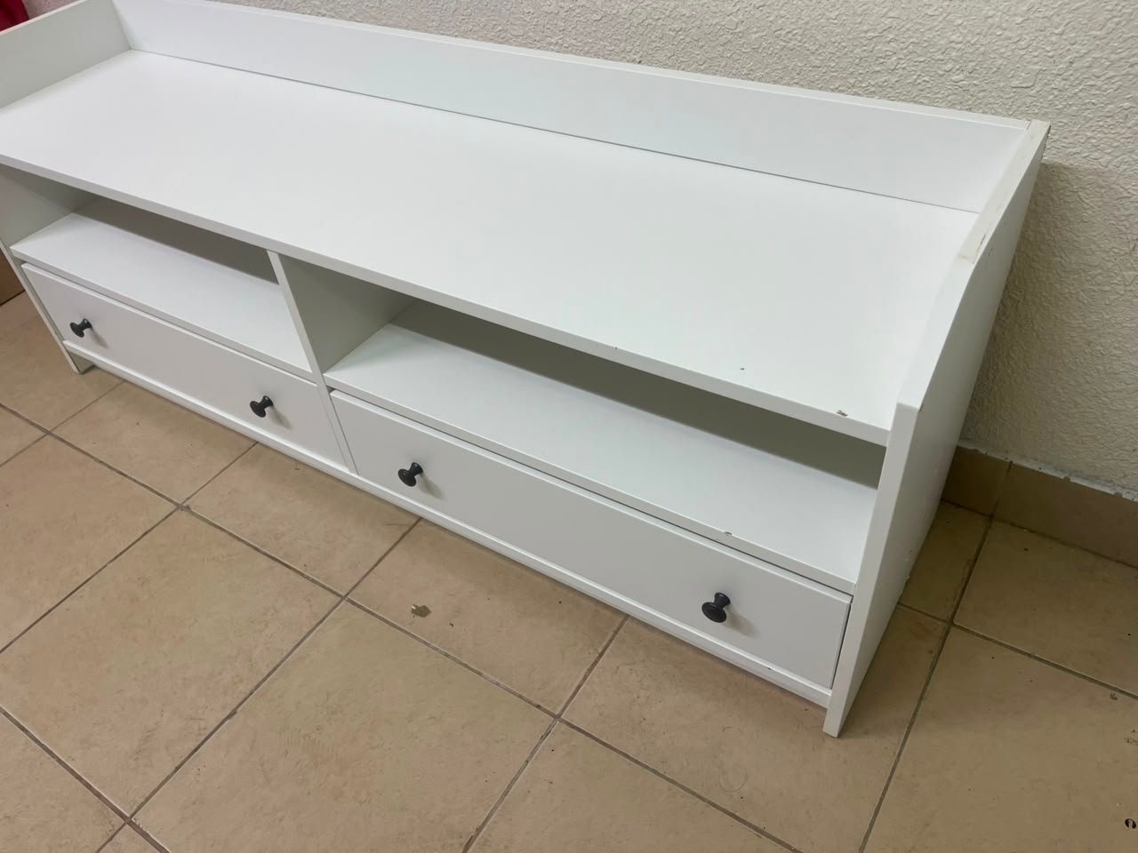 The IKEA HAUGA TV stand in white features a classic design with two drawers and open spaces. - Image 8