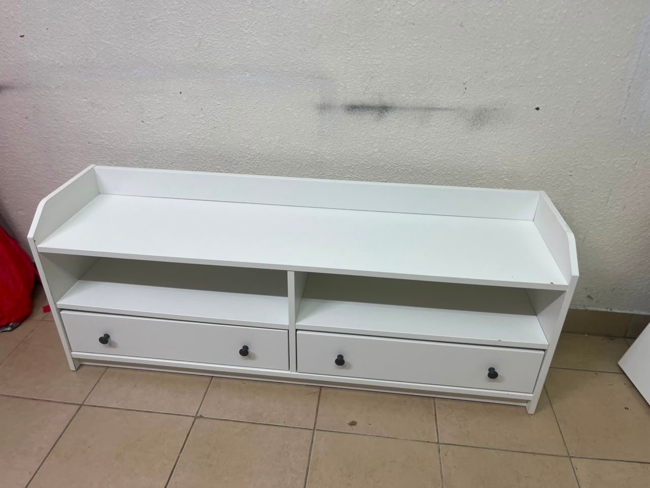 The IKEA HAUGA TV stand in white features a classic design with two drawers and open spaces. - Image 9