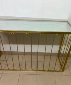 Modern console table with a gold metal frame and reflective glass top - Image 12