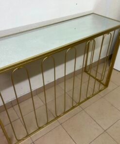 Modern console table with a gold metal frame and reflective glass top - Image 2