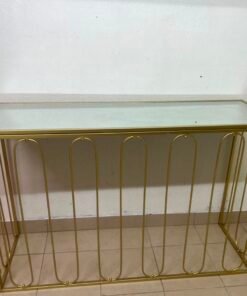 Modern console table with a gold metal frame and reflective glass top - Image 4