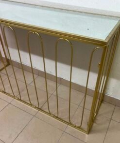 Modern console table with a gold metal frame and reflective glass top - Image 5